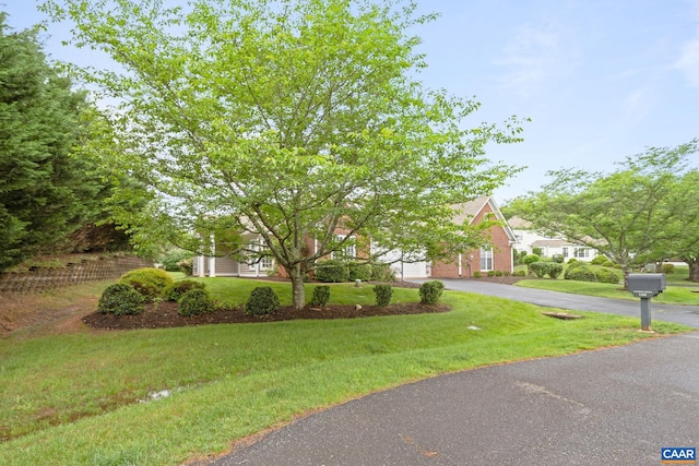 1269 Townbrook Xing, Charlottesville, VA 22901 - obstructed view of property featuring driveway and a front yard