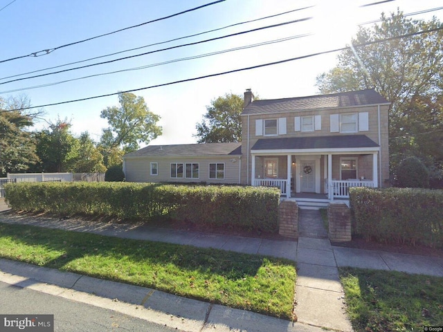 10021 Lorain Ave, Silver Spring, MD 20901 - view of front facade featuring a porch and a chimney