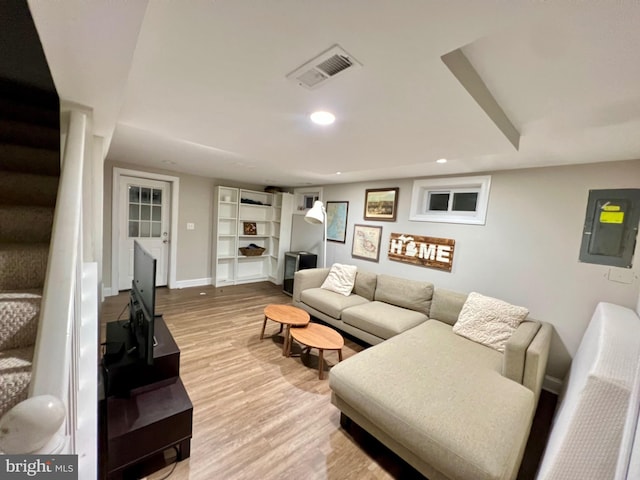 10021 Lorain Ave, Silver Spring, MD 20901 - living area with wood finished floors, baseboards, electric panel, recessed lighting, and stairs