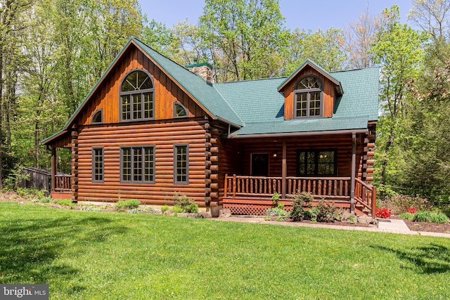 821 Sand Ridge Rd, Howard, PA 16841 - cabin featuring a porch, log siding, a front lawn, and a chimney