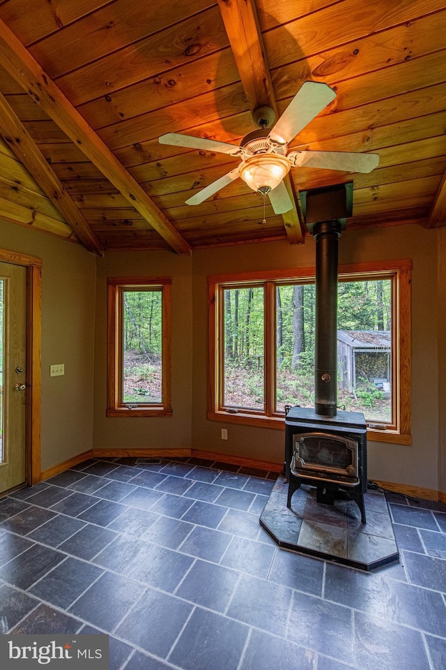 821 Sand Ridge Rd, Howard, PA 16841 - living area featuring wooden ceiling, healthy amount of natural light, stone tile flooring, and baseboards