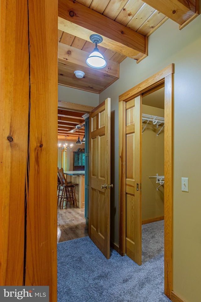821 Sand Ridge Rd, Howard, PA 16841 - hallway with wood ceiling, carpet floors, beamed ceiling, and baseboards