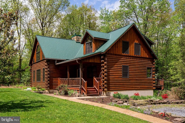 821 Sand Ridge Rd, Howard, PA 16841 - cabin with covered porch, log siding, a front lawn, and a chimney