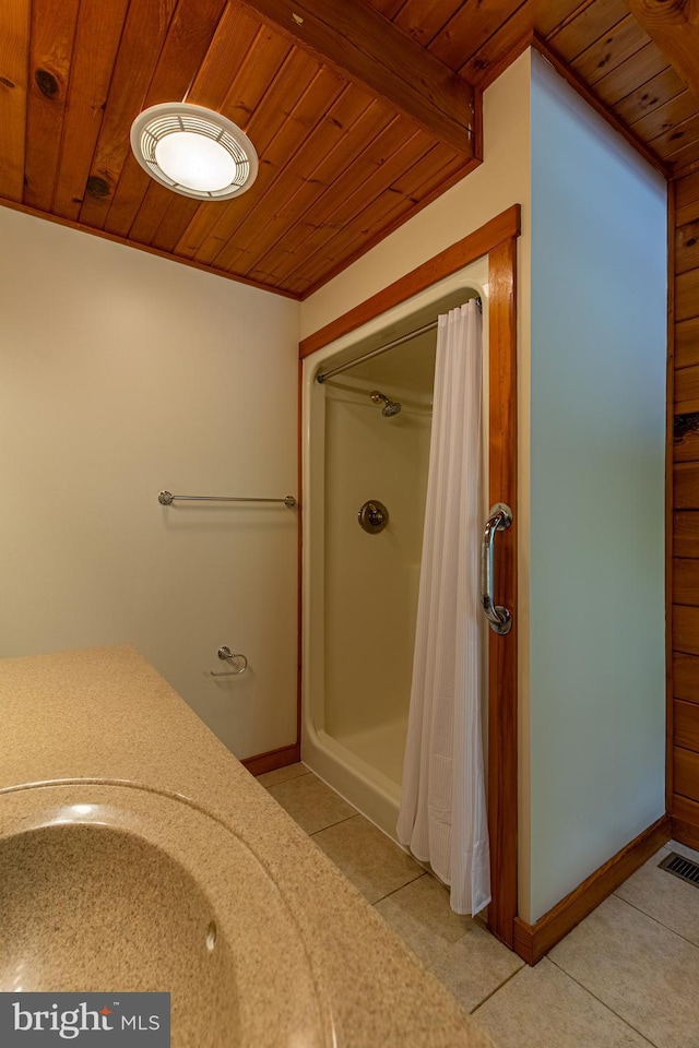 821 Sand Ridge Rd, Howard, PA 16841 - bathroom with wooden ceiling, tile patterned flooring, a shower with curtain, and baseboards
