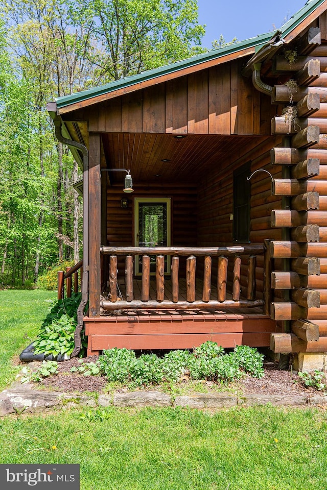 821 Sand Ridge Rd, Howard, PA 16841 - view of side of property featuring log siding and covered porch