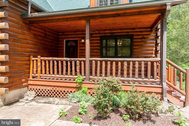 821 Sand Ridge Rd, Howard, PA 16841 - doorway to property with covered porch and log siding