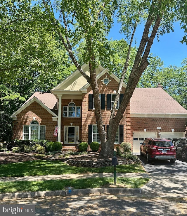 12906 Brafferton Ct, Herndon, VA 20171 - view of front facade featuring brick siding, an attached garage, and concrete driveway