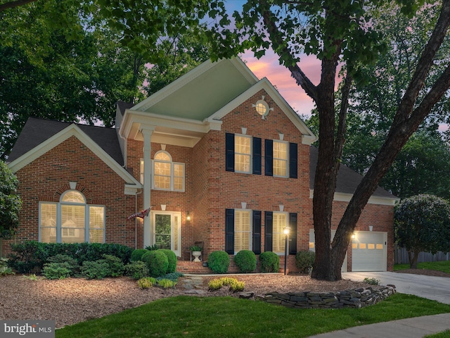12906 Brafferton Ct, Herndon, VA 20171 - view of front of house with brick siding, driveway, and a garage