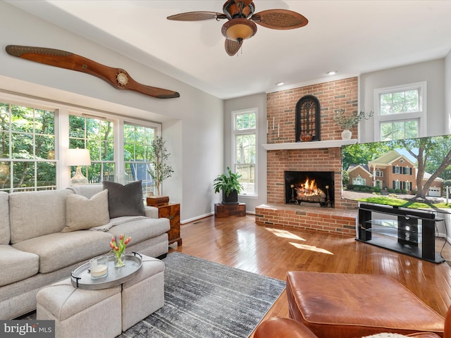 12906 Brafferton Ct, Herndon, VA 20171 - living room with ceiling fan, wood-type flooring, a fireplace, baseboards, and recessed lighting