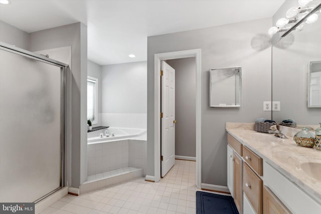 full bath with a garden tub, a stall shower, baseboards, tile patterned flooring, and double vanity