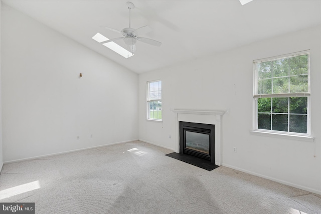 7 Gazelle Pl, New Castle, DE 19720 - unfurnished living room with a ceiling fan, carpet, a fireplace with flush hearth, lofted ceiling, and baseboards