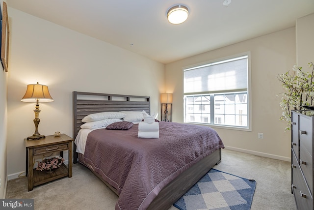 bedroom with carpet flooring and baseboards