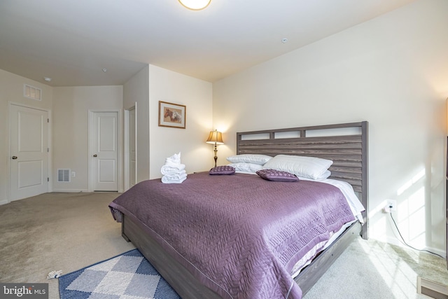 bedroom with carpet flooring and baseboards