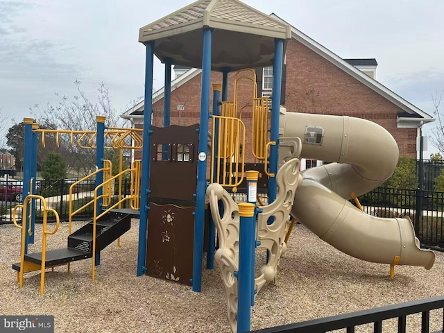 community jungle gym featuring fence