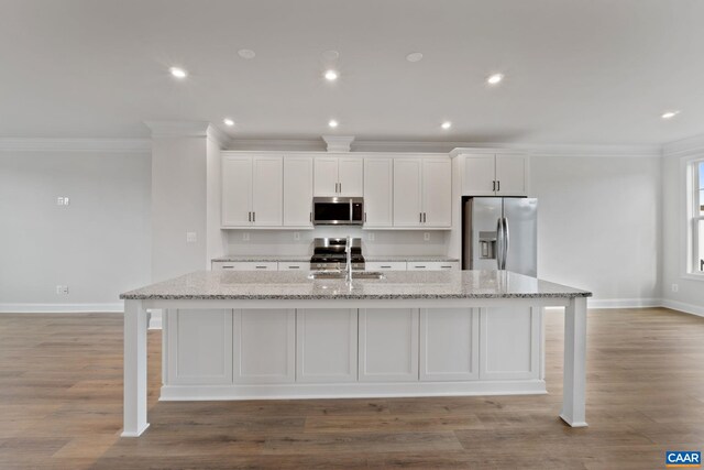 2 Talen Ln, Charlottesville, VA 22911 - kitchen featuring appliances with stainless steel finishes, ornamental molding, a kitchen island with sink, a sink, and baseboards