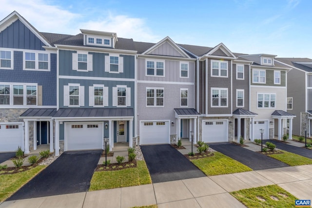 2 Talen Ln, Charlottesville, VA 22911 - townhome / multi-family property featuring driveway, board and batten siding, stone siding, and a standing seam roof