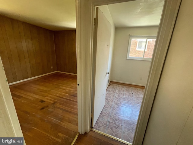 3208 28th Pkwy, Temple Hills, MD 20748 - hall featuring wood finished floors, wooden walls, and baseboards