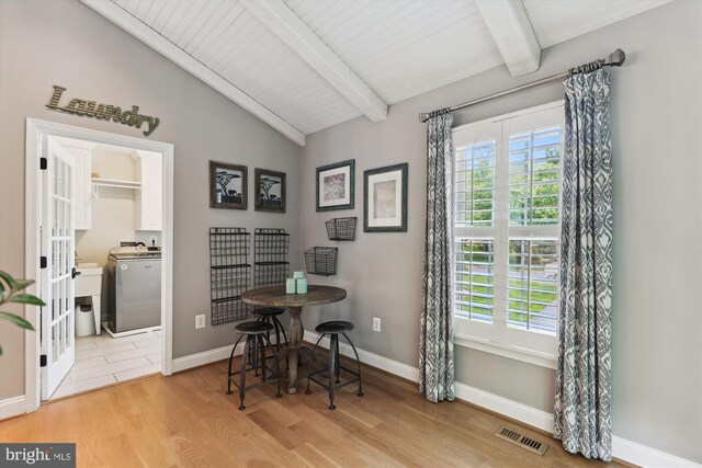 11476 Bronzedale Dr, Oakton, VA 22124 - dining area featuring washer / dryer, wood finished floors, and baseboards