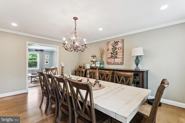 11476 Bronzedale Dr, Oakton, VA 22124 - dining room featuring wood finished floors, a chandelier, crown molding, baseboards, and recessed lighting