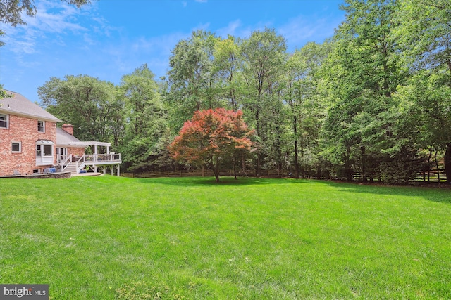 11476 Bronzedale Dr, Oakton, VA 22124 - view of grassy yard with a wooden deck and stairs