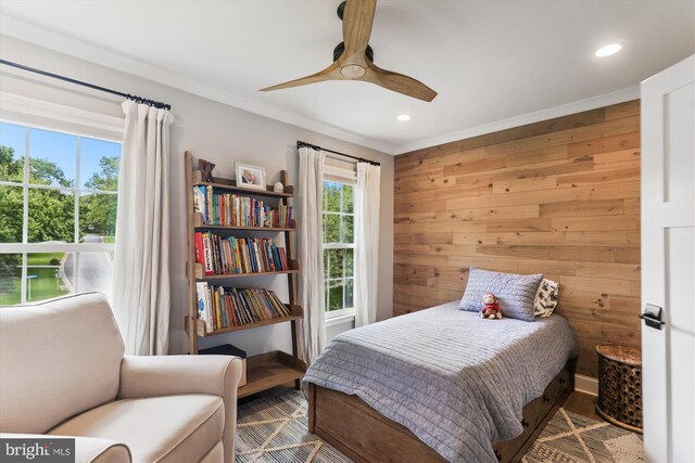 11476 Bronzedale Dr, Oakton, VA 22124 - bedroom with recessed lighting, wooden walls, ceiling fan, wood finished floors, and baseboards
