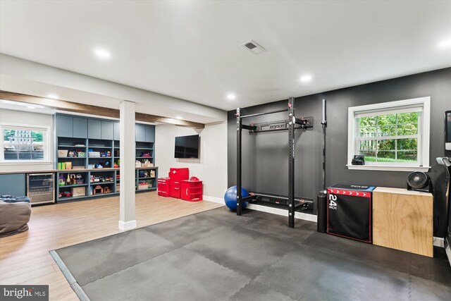 11476 Bronzedale Dr, Oakton, VA 22124 - exercise area featuring wine cooler, plenty of natural light, recessed lighting, baseboards, and wood finished floors