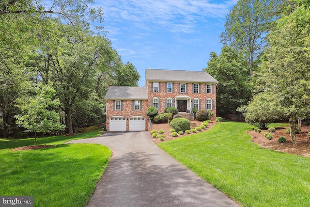 11476 Bronzedale Dr, Oakton, VA 22124 - colonial home featuring driveway, brick siding, and a garage