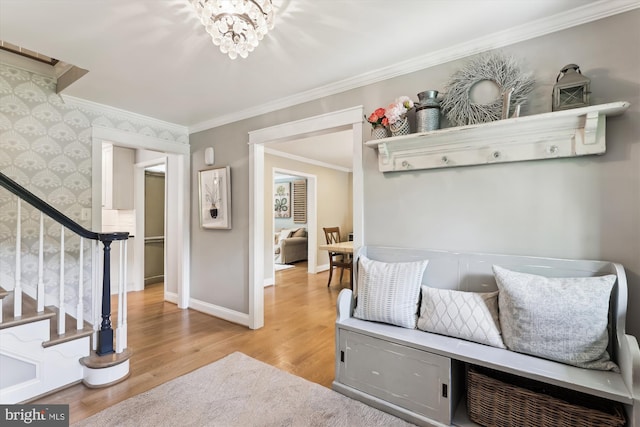11476 Bronzedale Dr, Oakton, VA 22124 - mudroom with light wood-type flooring, ornamental molding, wallpapered walls, baseboards, and a chandelier