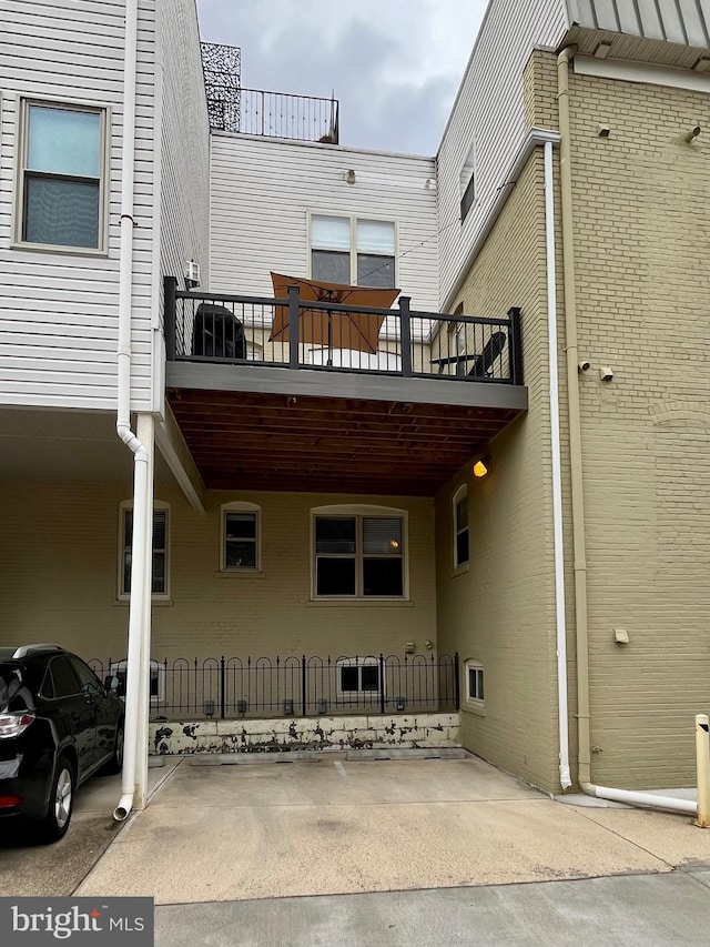 rear view of house with a balcony