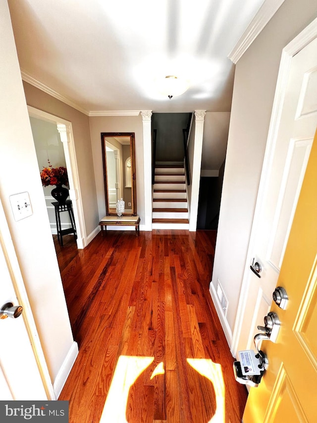 6572 Flagmaker Ct, Falls Church, VA 22042 - corridor featuring decorative columns, stairway, wood finished floors, crown molding, and baseboards