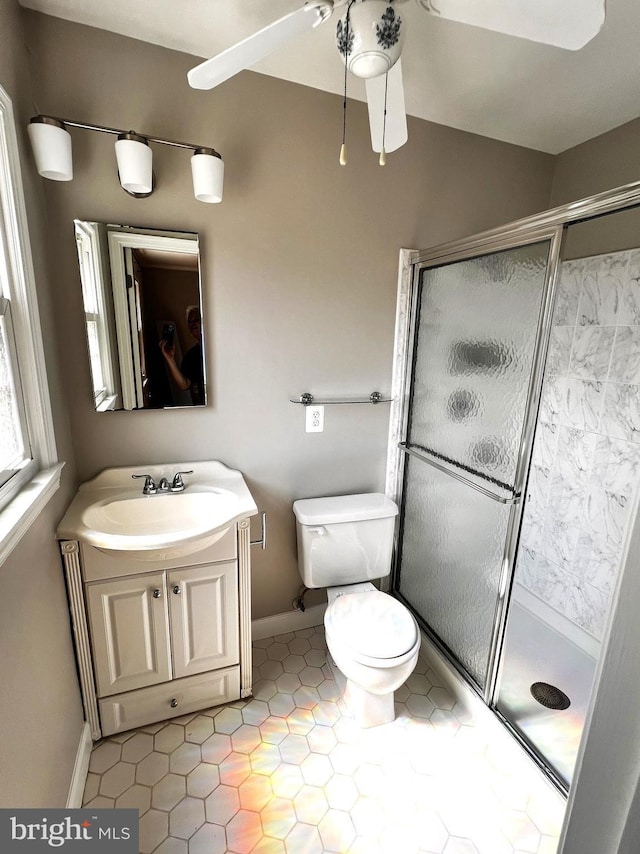 6572 Flagmaker Ct, Falls Church, VA 22042 - full bath featuring a shower stall, vanity, toilet, ceiling fan, and tile patterned floors