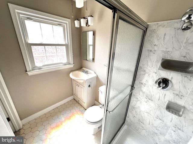 6572 Flagmaker Ct, Falls Church, VA 22042 - full bath featuring a stall shower, vanity, toilet, baseboards, and tile patterned floors