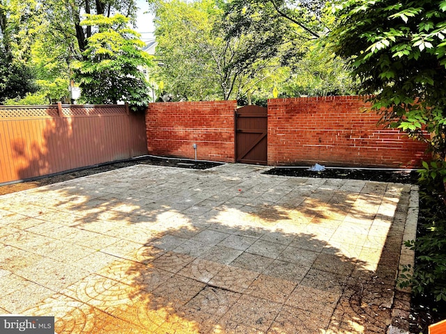 6572 Flagmaker Ct, Falls Church, VA 22042 - view of patio / terrace featuring a gate