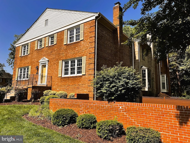 6572 Flagmaker Ct, Falls Church, VA 22042 - view of side of property featuring a chimney and brick siding