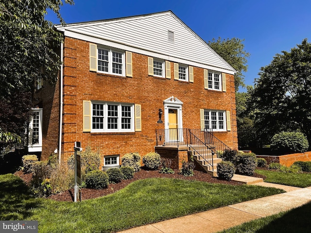 6572 Flagmaker Ct, Falls Church, VA 22042 - view of front of home featuring a front lawn and brick siding