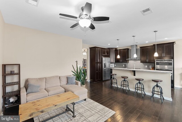 23483 Aldie Manor Ter, Ashburn, VA 20148 - living room featuring ceiling fan, dark wood finished floors, recessed lighting, and baseboards