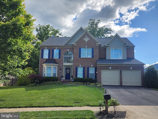 7637 Northington Ct, Gainesville, VA 20155 - view of front of home with asphalt driveway, a garage, and brick siding