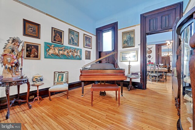 226 S 5th St, Reading, PA 19602 - sitting room with a chandelier and light wood finished floors
