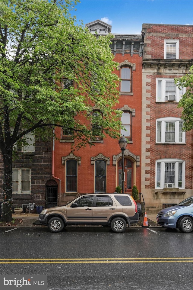226 S 5th St, Reading, PA 19602 - view of front of house featuring brick siding and cooling unit