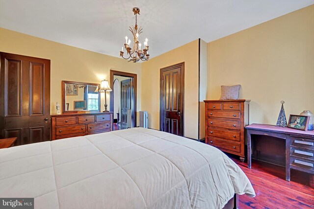 226 S 5th St, Reading, PA 19602 - bedroom featuring a chandelier and wood finished floors