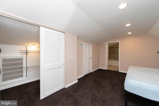 unfurnished bedroom featuring carpet, vaulted ceiling, a closet, baseboards, and recessed lighting