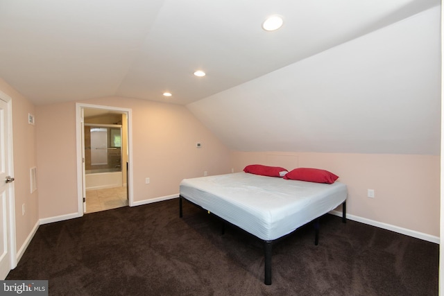 bedroom featuring carpet flooring, lofted ceiling, recessed lighting, baseboards, and ensuite bath