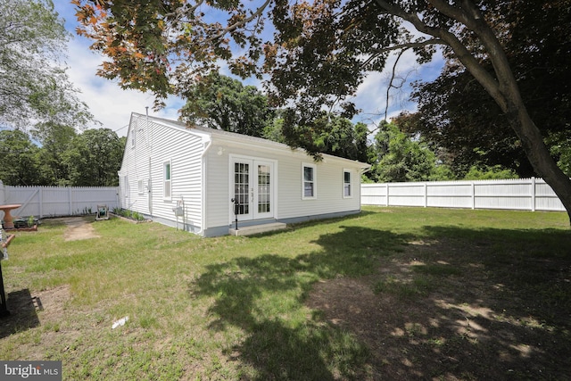 back of house featuring french doors