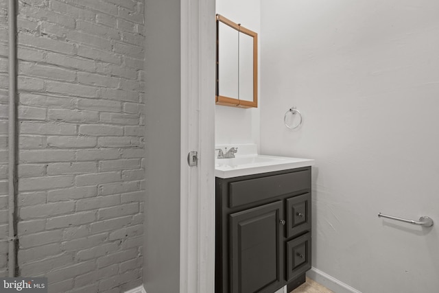 bathroom featuring vanity and baseboards