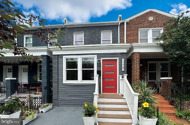 1778 Lang Pl NE, Washington, DC 20002 - view of front facade featuring covered porch and brick siding