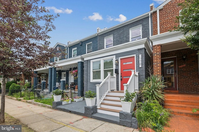 1778 Lang Pl NE, Washington, DC 20002 - view of property featuring a porch and mansard roof