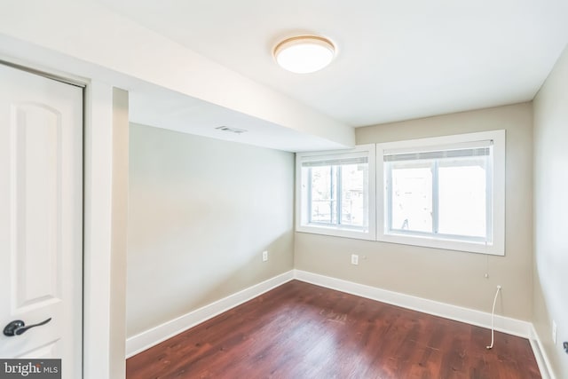 1778 Lang Pl NE, Washington, DC 20002 - unfurnished room with baseboards and dark wood-style flooring
