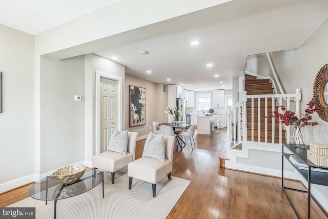 1778 Lang Pl NE, Washington, DC 20002 - living room with stairway, light wood-style floors, recessed lighting, and baseboards