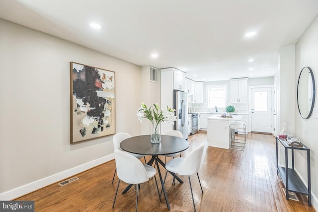 1778 Lang Pl NE, Washington, DC 20002 - dining room with recessed lighting, light wood-type flooring, and baseboards