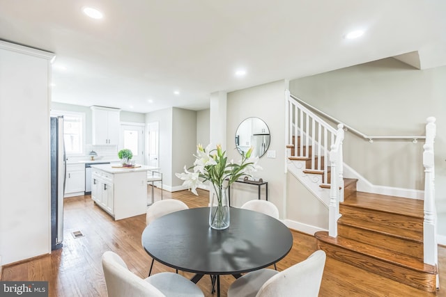 1778 Lang Pl NE, Washington, DC 20002 - dining room featuring baseboards, light wood-type flooring, stairs, and recessed lighting